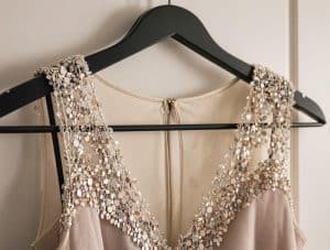 Elegant sequin-trimmed evening dress professionally dry cleaned and hanging at Bims Laundry Cafe in Bothell