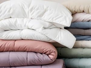 Colorful comforter professionally dry cleaned and ready for pickup at Bims Laundry Cafe in Everett