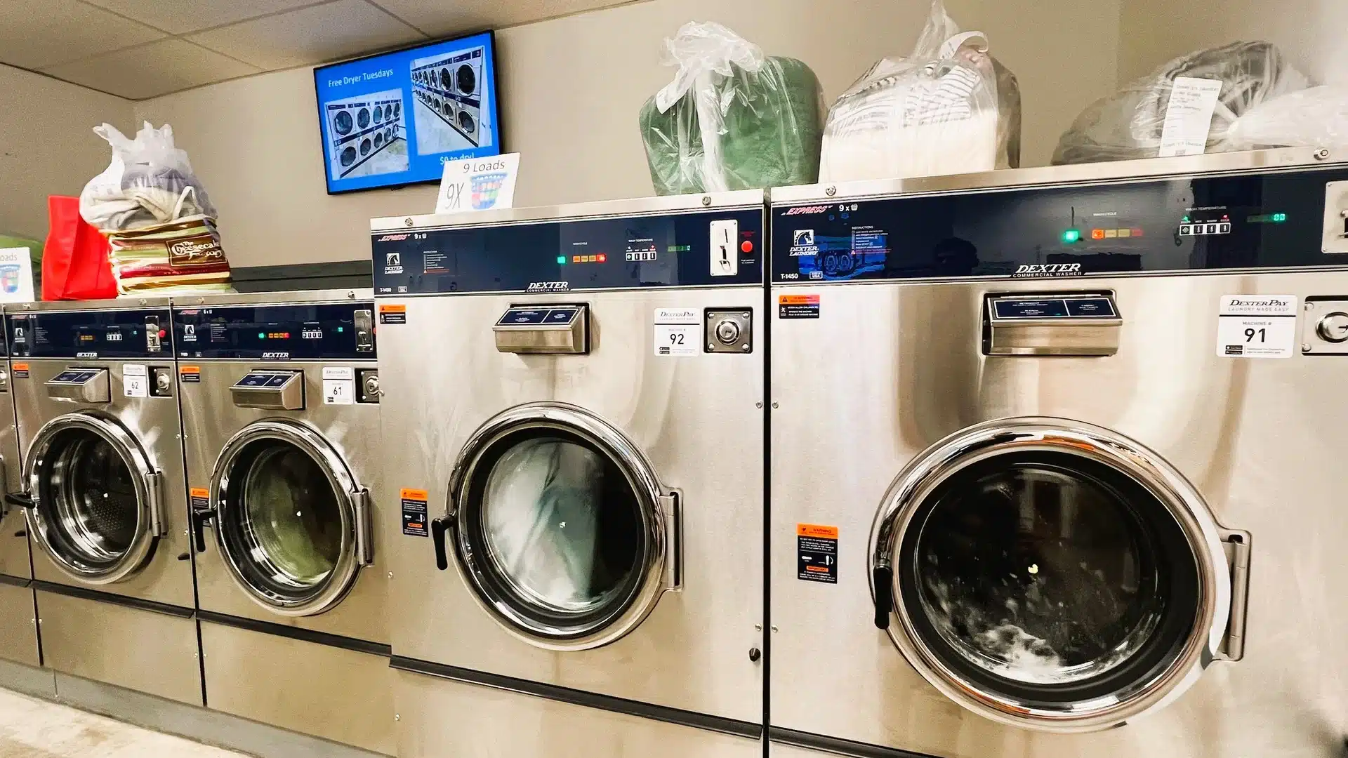Exclusive 90lb Dexter washers at Bims Laundry Café, perfect for bedding and commercial laundry